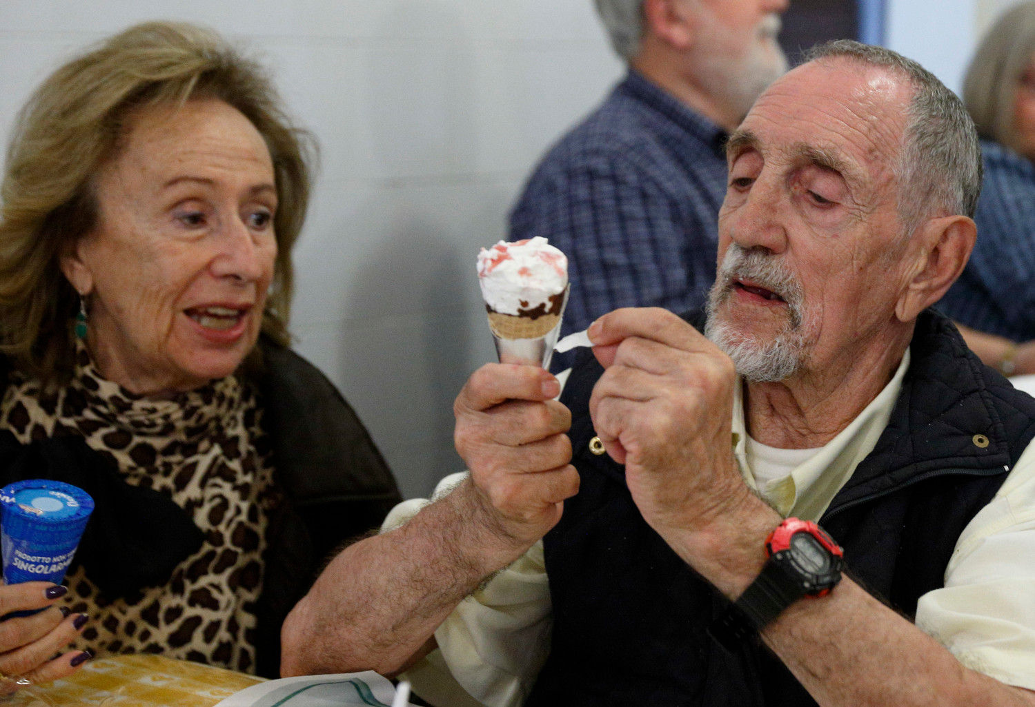 People eat ice cream cones donated by Pope Francis at a Sant’Egidio soup kitchen in Rome April 23. In honor of his name day, the feast of St. George, the Pope donated 3,000 servings of ice cream to soup kitchens and homeless shelters around Rome.